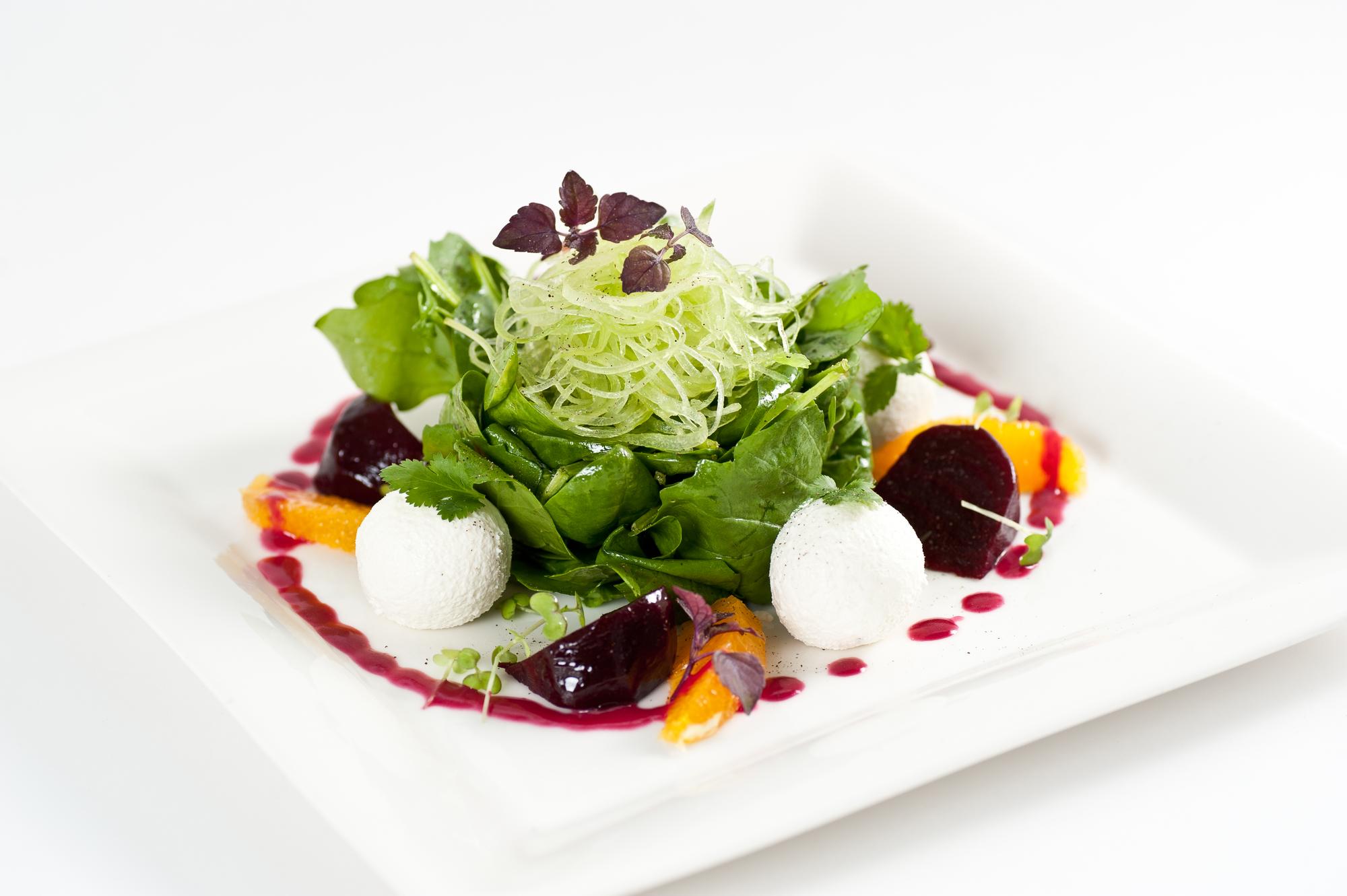 Plated seasonal salad with dressing