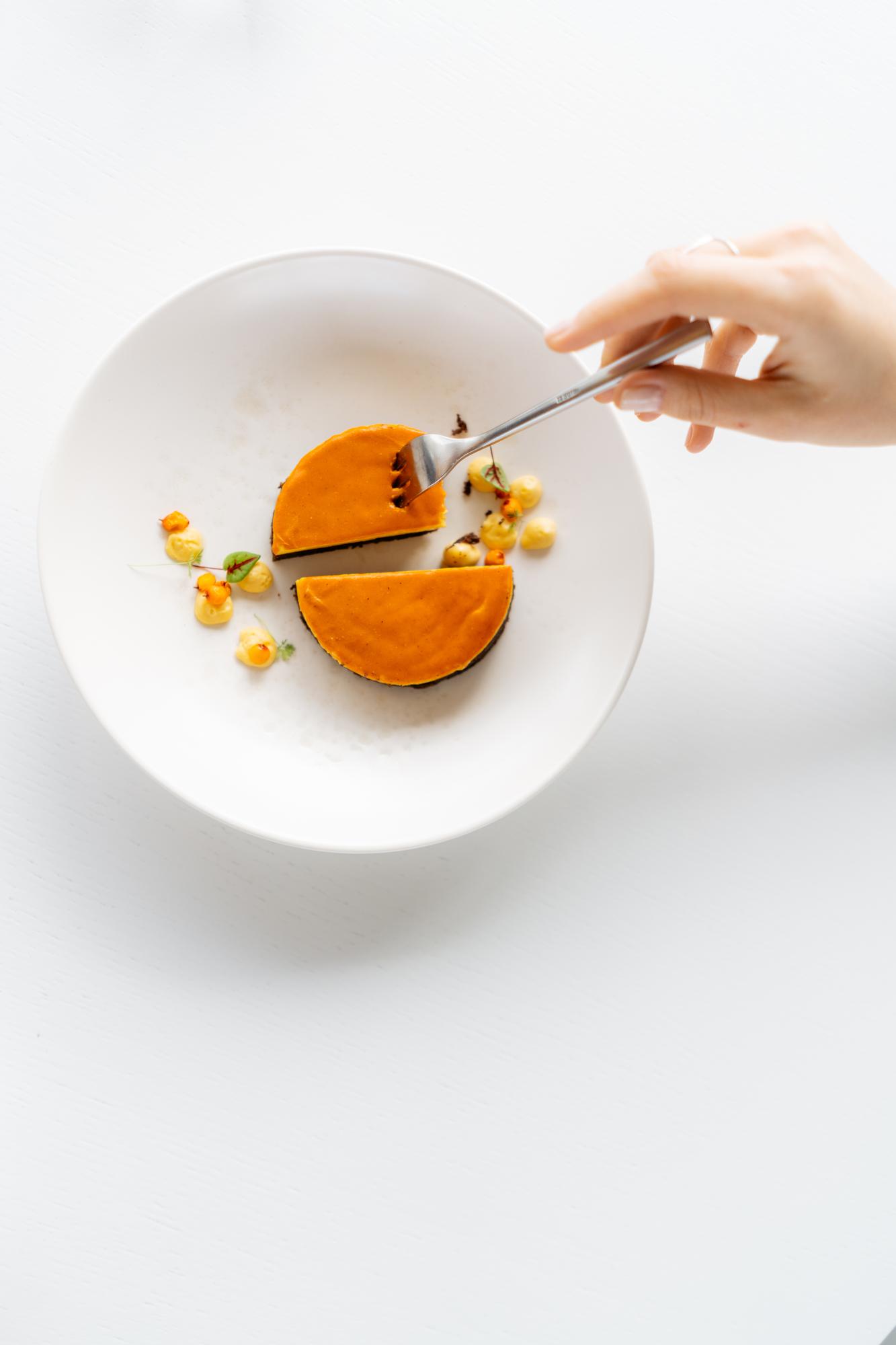 Chef arranging a minimalist plated dish